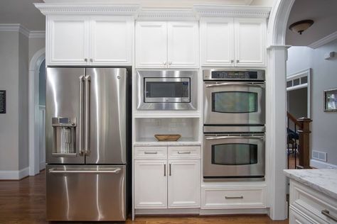 Quartz countertops, refinished white cabinets with custom carpentry. New top knobs hardware and new subway tile backsplash. Hidden Microwave, Wall Oven Kitchen, Oven Kitchen, Wall Oven Microwave, Kitchen Oven, Built In Ovens, Double Oven, Kitchen Remodel Ideas, Reno Ideas