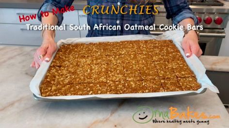 Crunchies — Traditional South African Oatmeal Cookie Bars | OrnaBakes International Breakfast, Crunchie Recipes, African Desserts, South African Culture, South African Food, Coconut Squares, South African Desserts, South African Dishes, Oatmeal Cookie Bars