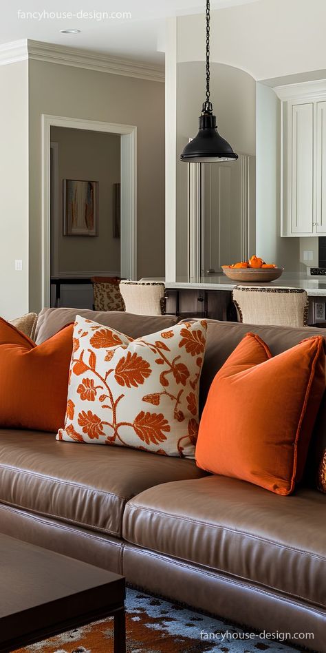 The bold use of burnt orange in this living room adds a pop of vibrancy, complemented by the sleek furniture and stylish decor. Burnt Orange Living Room Ideas, Orange Living Room Ideas, Burnt Orange Interior, Burnt Orange Living Room, Orange Tips, Orange Living Room, Kitchen Entrance, Orange Details, Living Room Orange