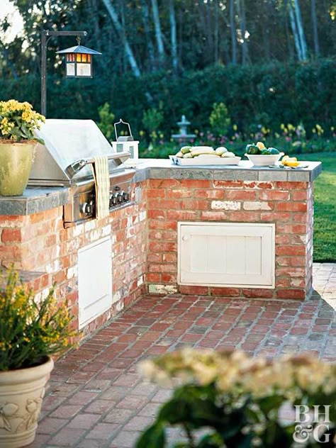 Slate countertops in this kitchen double as a food prep area and a buffet space. You can even place seating on the other side of the counter for more space. The brick and stainless-steel grill are also good materials for outdoor use. #outdoorideas #patioideas #outdoorkitchenideas #bhg Brick Grill, Small Outdoor Kitchens, Outdoor Grill Area, Brick Bbq, Outdoor Bbq Area, Backyard Barbeque, Outdoor Kitchen Countertops, Outdoor Kitchen Ideas, Outdoor Bbq Kitchen