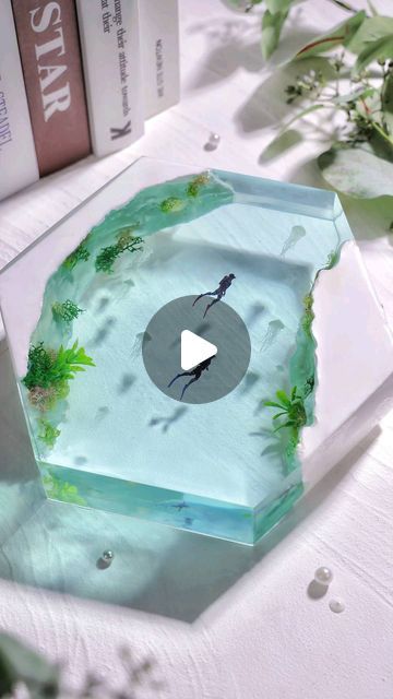 Let's Resin on Instagram: "💙 Let's explore the enchanting underwater world.  🌿 Witness the crafting process of this stunning underwater resin diorama, brought to life using our deep-pour resin kit. The underwater plants, delicately clinging to luminous rocks that radiate in the darkness, are meticulously bound together by our UV resin added with glow-in-the-dark powder. This is the key to its mesmerizing glow in the dark!  What do you think of it? Like it or love it? 😁 🔗Claim your 30% discount on our 51oz Deep Pour Resin with code: 𝟑𝟎𝐈𝐙𝟔𝟓𝐋𝐔. Link in our bio.   #letsresin #resinart #epoxyresin #resinepoxy #resincasting #dioramaart #diorama #resincreations #resindiorama #underwaterart #epoxyart #uvresincraft" Resin Underwater Scene, Deep Pour Resin, Uv Resin Crafts, Diy Uv Resin, Resin Diorama, Underwater Plants, Epoxy Ideas, Underwater Art, Diy Resin Projects