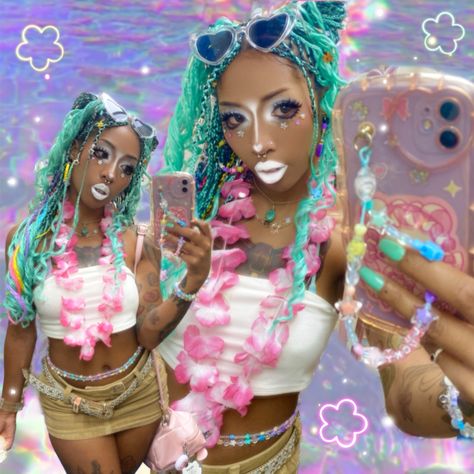 A Black Gyaru aka “Kurogyaru” with mint & rainbow  knotless braids taking a mirror selfie. They are wearing white eye, nose and lips makeup in the “Yamamba” substyle of Gyaru. They are wearing a pink Hawaiian Lei, white tube top, rainbow waist beads, khaki miniskirt with a rainbow bikini underneath. The background is an rainbow iridescent water edit. The photo is edited to portray a tropical core Y2k aesthetic. Beach Gyaru Makeup, Tropic Gyaru, Yamamba Gyaru, Mamba Gyaru, Gyaru Black, Beach Gyaru, Tropical Gyaru, Manba Gyaru, Kuro Gyaru