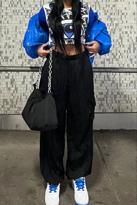 blue crop puffer coat, black flowy joggers, blue long sleeve crop top, eye pattern top, nike air force 1 S50 sneakers, black puffer chain bag, white beanie hat | outfit details, blue aesthetic, casual style, nyc style, nyc fashion, nyc ootd, casual style, black girl fashion, black girl aesthetic, streetwear, casualwear, casual outfit, minimal streetstyle, everyday outfit, matching details, aesthetic outfit Black And Blue Clothes Outfit, Royal Blue Streetwear Outfit, Black And Blue Outfit Aesthetic, Neon Blue Outfit, Royal Blue Streetwear, Blue And Black Outfits, Blue Streetwear Outfit, Black Blue Outfit, Black And Blue Streetwear