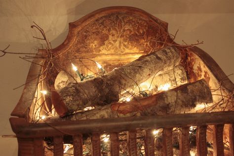 This gives me ideas for the fireplace in summer -- A few pretty logs and a string of lights... Fake Fireplace Logs, Real Fireplace, Woodburning Fireplace, Fake Fire, Fake Fireplace, Fireplace Grate, Log Candles, Iron Fireplace, Fireplace Logs