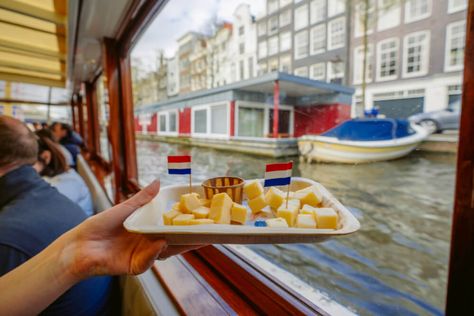 One of THE best things to do in Amsterdam is a canal cruise. This post rounds up all the most unique Amsterdam canal cruises you can take, featuring bottomless drinks, pizza, cheese and more. This post is a must read before planning your Amsterdam itinerary and definitely before you travel to the Netherlands. #Travel #amsterdam Unique Amsterdam, Amsterdam Attractions, Amsterdam Itinerary, Heineken Experience, Cruise Tickets, Things To Do In Amsterdam, Travel Amsterdam, Pizza Cheese, To Do In Amsterdam