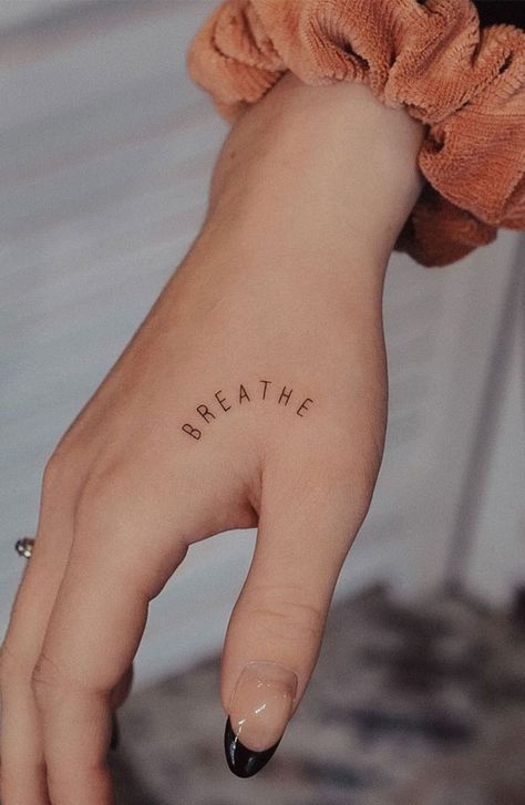 70+ Beautiful Tattoo Designs For Women : Breath Tattoo on Hand I Take You | Wedding Readings | Wedding Ideas | Wedding Dresses | Wedding Theme Breathe Tattoos For Women Small, Wedding Band Tattoo Ideas, Breath Tattoo, Band Tattoo Ideas, Tattoos That Mean Something, Just Breathe Tattoo, Tattoo Ideas For Couples, Simple Hand Tattoos, Beautiful Tattoo Designs