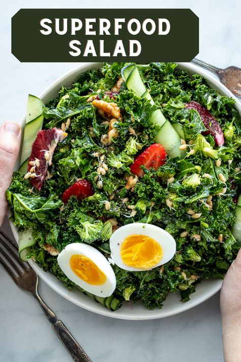 Are you ready for the healthiest salad yet? So much goodness in one bowl, this salad will certainly help you stick to your health goals. It is loaded with kale, broccoli, pecans, chia seeds, cucumber ribbons, strawberries, boiled eggs, blood oranges and sprouted wheat! Click or pin for later Superfoods Salad, Cucumber Ribbons, Hearty Salad Recipes, Sprouted Wheat, Orange Vinaigrette, Protein Salad, Sprouted Grains, Green Kale, Superfood Salad