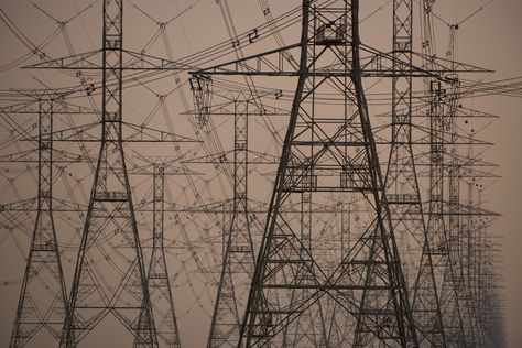 Power lines in Saudi Arabia disappear into the vastness of the desert (Joe Mc Nally, 2013) Joe Mcnally, Hunger Games Districts, Solar Punk, Transmission Tower, Power Lines, Book Trailer, Graphic Tshirt Design, Colour Photograph, Anime Angel