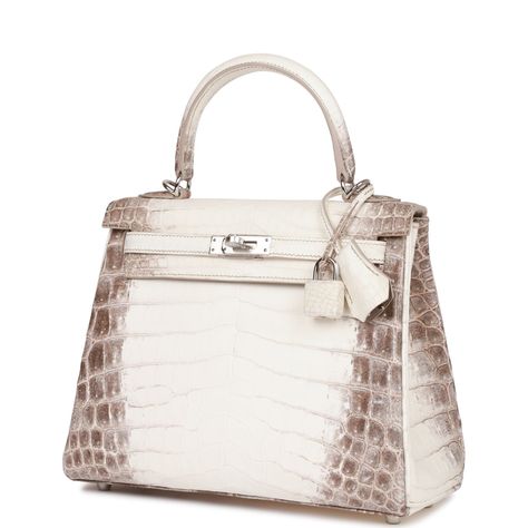 This Retourne Kelly is in Himalaya matte niloticus crocodile with palladium hardware and has tonal stitching, front flap, two straps with center toggle closure, clochette with lock and two keys, single rolled handle and removable strap.The interior is lined with craie chevre and has a zip pocket with an Hermes engraved zipper pull and two open pockets on the opposite side.Payment for this item is by Bank Wire only unless other arrangements have been made.Collection: ZOrigin: FranceCondition: New and never (Plastic on hardware)Accompanied by: Hermes box, Hermes dustbag, clochette, lock, two keys, clochette dustbag, shoulder strap, shoulder strap dustbag, carebook, rainhat, CITES and feltMeasurements: 9.8" width x 7.5" height x 3.5" depth; 3.5" handle drop Hermes Kelly Crocodile, Hermes Crocodile Bag, Hermes Kelly Retourne, Kelly Hermes, Family Bag, Birkin Bags, Kelly Retourne, Handbag Collection, Hermes Box