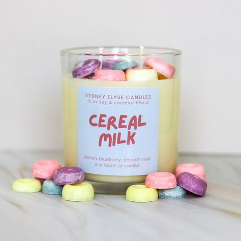 Take a nostalgic trip back to carefree mornings with our Cereal Milk scented candle, designed to evoke the joyful simplicity of a bowl of fruity cereal and milk. Featuring delightful notes of zesty lemon, tart blueberry, smooth milk, and comforting vanilla, this candle brings a whimsical and comforting aroma to your space. Made from a luxurious blend of soy and coconut wax, and cotton wicks, it burns cleanly and evenly, filling your home with the irresistible scent of Cereal Milk. Essential Oil Candle Blends, Cereal Candle, Candle Blends, Fruit Loops Cereal, Cozy Dorm, Lemon Candle, Cereal Milk, Coconut Candle, Candle Molds Diy