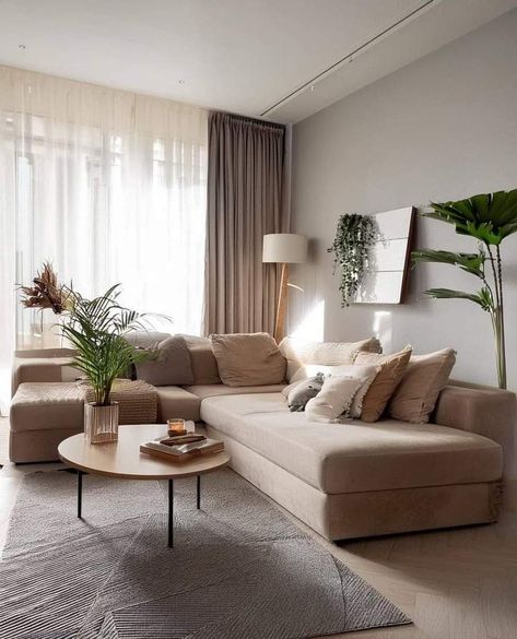 White living room with brown sofa coffee table decor and Gray carpet #livingroom #sofa Neutral Color Living Room Ideas, Living Room With Brown Sofa, Neutral Color Living Room, Gray Carpet, Livingroom Sofa, Sofa Gray, Sofa Coffee Table, Beige Living Rooms, Coffee Table Decor