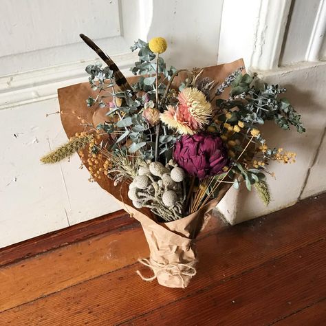 A dried flower bouquet made with dried artichoke, brunia, eucalyptus, acacia/mimosa, strawflower, billy ball, pheasant feather Billy Balls, Simple Minds, Dried Bouquet, Pheasant Feathers, Farm Stand, Summer Solstice, Dried Flower Bouquet, Grapevine Wreath, Grape Vines