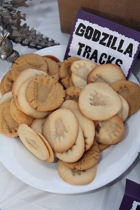 Sugar Cookie Godzilla Tracks Godzilla Food Ideas, Godzilla Themed Food, Godzilla Craft, Godzilla Party Food, Godzilla Birthday Party Food, Goonies Party Food, King Kong Party Ideas, Godzilla Themed Birthday Party, Godzilla King Kong Birthday Party