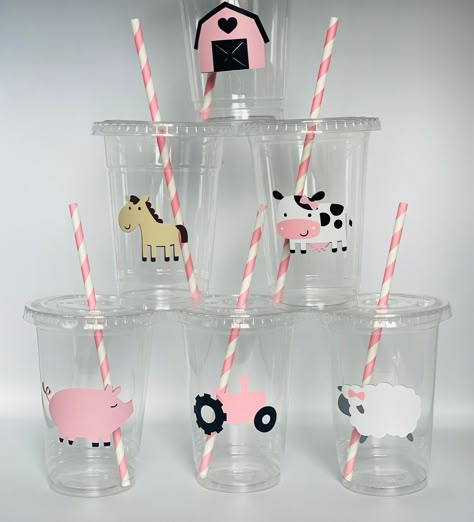 These are great for any  farm inspired party. Each cup is 16 oz. and made from a sturdy disposable plastic. These are decorated with vinyl stickers and come with matching paper straws and lids. These are perfect for small children who easily spill. You can also stuff these with candy, snacks, and little toys for a great party favor.  Please click the amount button to see pricing on these cups. If you want a different amount then what is available please message me for a custom listing.  I can also customize these cups. If you would like a child's name on each cups it is an extra $0.25 per cup. Just add this listing along with your order of cups: https://www.etsy.com/listing/484625057/custom-names-to-each-cup?ga_search_query=custom&ref=shop_items_search_4 If you would like a saying (ex. Hap Pink Tractor Birthday Party, Pink Farm Birthday Party Decorations, Barn Yard Birthday Party Girl, Farm Theme Party Food, Farm Animal Birthday Party Girl, Three I E I O Party Girl, Farm First Birthday Girl, Girly Farm Birthday Party, Farm Themed Birthday Party Girl