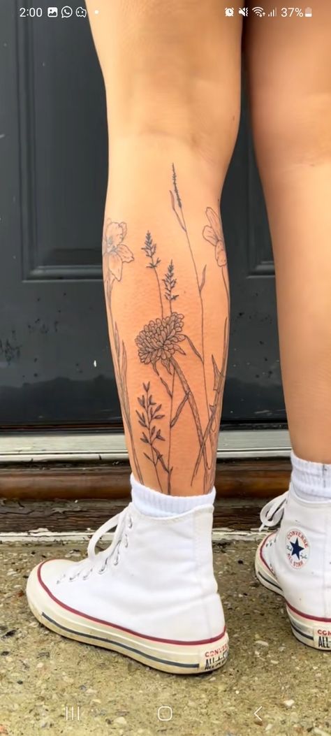 Flower Going Up Leg Tattoo, Tiny Tattoo Leg Sleeve, Flower Tattoo On Shin, Flowers Calf Tattoo, Flower Around Ankle Tattoo, Wild Flower Calf Tattoo, Girly Thigh Tattoos Women, Wildflower Tattoo Lower Leg, Flower Wrap Leg Tattoo