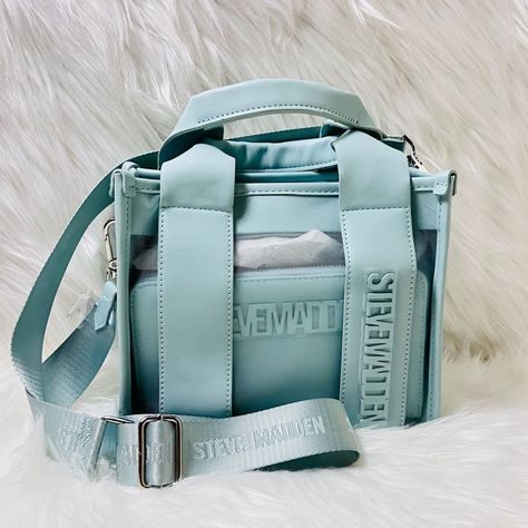 The Steve Madden Bwebber M-Satchel Is A Crossbody Bag That Comes With A Wallet And Cosmetic Pouch. It Has A Flap Snap Closure, Silver Tone Hardware, And A Removable Guitar Strap. The Bag Measures 9” W X 7.75” H X 5.5” D, The Wallet Measures 8” X 4.25” X 1”, And The Clutch Measures 7.5” X 5.75” X 2”. Guitar Strap, Cosmetic Pouch, Purses And Handbags, Snap Closure, Steve Madden, Satchel, Crossbody Bag, Silver Tone, Guitar