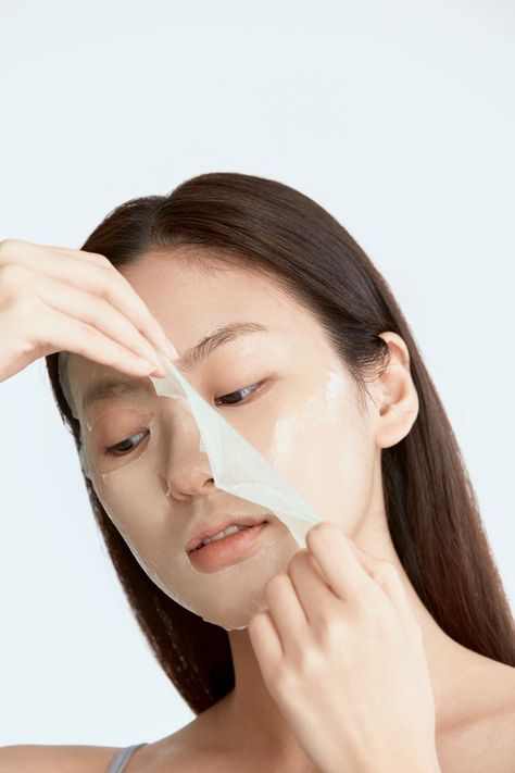 Woman pulling off sheet mask from face Axis Y, Sage Oil, Mask Sheet, Cellulose Fiber, Laneige Lip Sleeping Mask, Professional Skin Care Products, Lip Sleeping Mask, Repair Cream, Daily Skin Care Routine