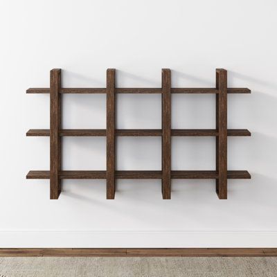 This floating wood shelf has everything you need - a decorative, functional, and spacious display shelf for your books, plants, or your favorite memorabilia. It highlights a shelf made from solid rubber wood. Assemble it horizontally or vertically to make an eye-catching statement piece in your living room, or assemble 2 or 3 shelves side by side for a beautiful accent and a roomy bookshelf for your wall. The floating shelves have fully adjustable interior and exterior shelves, so you can play w Floating Wood Shelf, Tiered Display Shelves, Wood Floating Shelf, Floating Bookshelf, Nathan James, Style Shelf, Wall Mounted Bookshelves, Small Collectibles, Bookcase Wall