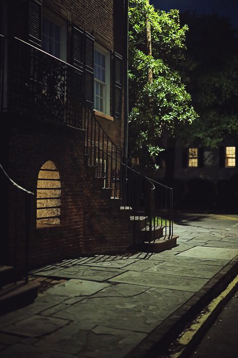 The façade of the Davenport House in Savannah looks spooky at night, with a pale yellow glow emanating from a barred vault located between the home's curved front staircases Savannah Georgia Spooky, Savannah Aesthetic, Davenport House, Savannah Hotels, Dream Location, Haunted Hotel, Most Haunted Places, Spooky House, Southern Gothic