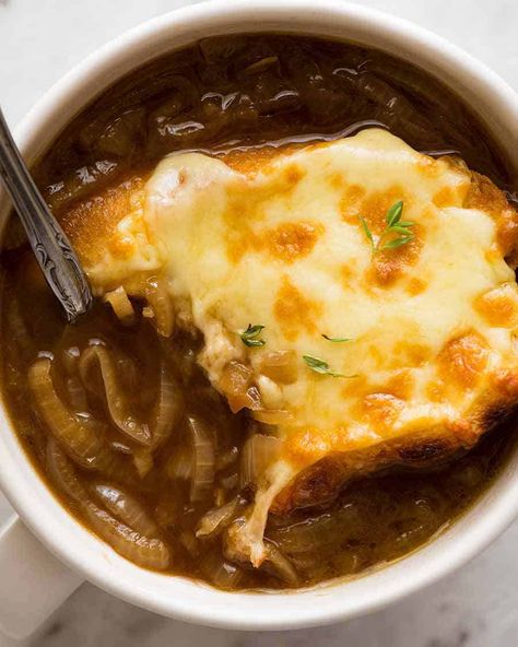 Close up overhead photo of French Onion Soup in a white bowl with a spoon Onion Soup Easy, Best French Onion Soup Recipe, Slow Cooker Caramelized Onions, Best French Onion Soup, Classic French Onion Soup, Onion Soup Recipe, Tomato Tortellini Soup, French Onion Soup Recipe, Onion Soup Recipes