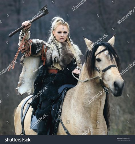 Beautiful furious scandinavian viking warrior woman with war makeup in traditional clothes riding a horse in a forest with ax in hand, threatening. Lagertha look. #viking #woman #makeup #warrior #ax #horse #ruthless #pagan #northern #dangerous #attack #princess #leader #riding Viking Horse Costume, Viking Horse Photoshoot, Viking Woman Makeup, Female Vikings, Viking Photoshoot, Viking Horse, Horse Warrior, Viking Costumes, Female Viking