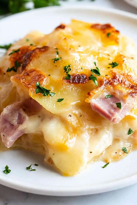 This cheesy scalloped potatoes and ham is absolutely to die for! Serve it as a creamy main course or decadent side dish to meats. Ham And Cheesy Scalloped Potatoes, Scalloped Potatoes And Ham Pioneer Woman, Freezer Scalloped Potatoes And Ham, Thanksgiving Ham Leftover Recipes, Joanna Gaines Side Dishes, Scalloped Potatoes With Cream Cheese, Creamy Scalloped Potatoes And Ham, Scalp Potatoes And Ham Recipes, Creamy Cheesy Scalloped Potatoes