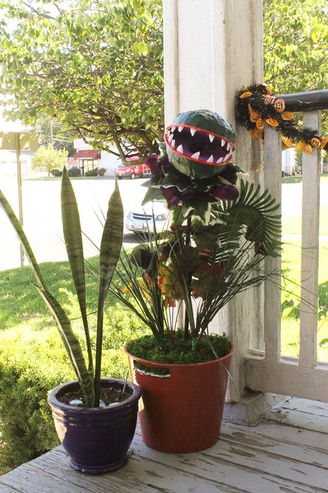 diy audrey 2 little shop of horrors venus fly trap halloween decoration via Va-Voom Vintage Haunted Garden Halloween Decor, Diy Venus Fly Trap Craft, Halloween Man Eating Plant Diy, Venus Fly Trap Craft, How To Make A Venus Fly Trap For Halloween, Venus Fly Trap Pumpkin, Diy Venus Fly Trap, Fake Venus Fly Trap, Venus Fly Trap Halloween Decor Diy