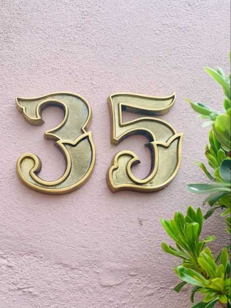 Number 35 brass house numbers on exterior house wall. Victorian Typography, Brass House Numbers, Front Door Numbers, Unique Front Doors, Front Door Hardware, Address Signs, Brass Door Knocker, Front Door Entrance, Door Numbers