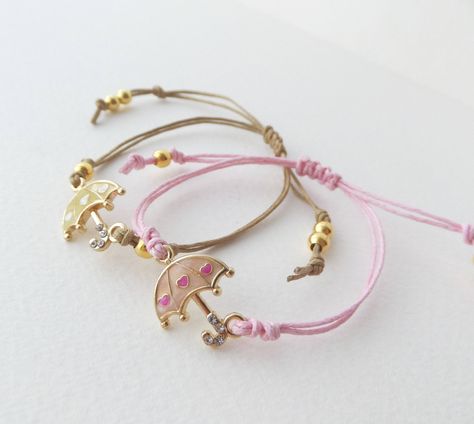 Gold Umbrella Bracelet, Adjustable Cotton Cord Bracelet, Pink or Beige Enamel Crystal Set, Gift for Girls #KnottedBracelet #CottonCordBracelet #2ndAnniversaryGift #BeigeCordBracelet #AdjustableBracelet #PinkCordBracelet #EnamelAndCrystal #GoldBracelet #BffGifts #TeenGirlGift Gold Umbrella, Bracelet Cotton, Adjustable Cord Bracelet, Cotton Cord Bracelet, 2nd Anniversary Gift, Bracelet Cord, Daisy Bracelet, Bracelet Knots, Casual Jewelry