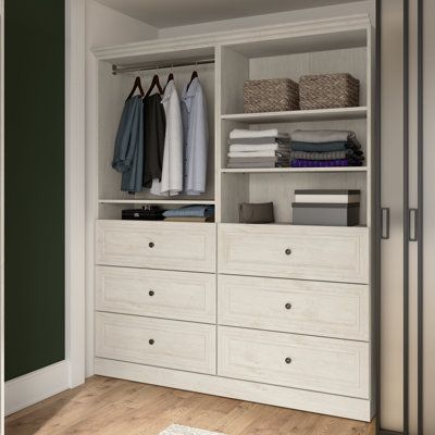 This walk-in closet system adds an elegant look to your bedroom while keeping your wardrobe organized. Crafted from engineered wood, it features a mix of six fixed and adjustable shelves, allowing you to customize your storage needs. The system also includes six drawers on smooth ball-bearing slides for easy access to clothes and bedding, and two clothing rods to hang your favorite outfits. Designed to be set up as one multifunctional unit or two separate organizers, it comes in a linen white oa Bestar Closet, Clothes Storage Solutions, Closet Behind Bed, Closet Organizer With Drawers, Free Standing Closet, Drawers Cabinet, Closet Systems, Open Closet, Storage Place