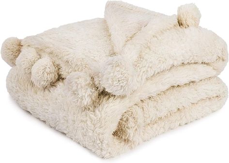 11 Barefoot Dreams Blanket Alternatives That Are Less Expensive – SheKnows Warm Blankets Cozy, Pom Pom Throw Blanket, Beige Throws, Cream Throw, Pom Pom Throw, Pom Pom Blanket, Decorative Throws Blanket, Couch Throw Blanket, Soft Sofa