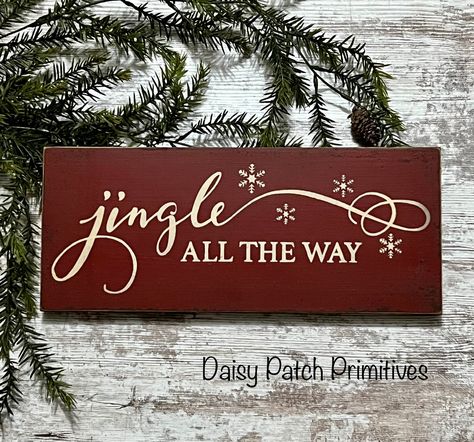 "Jingle All The Way Christmas sign is adorable and will add just the right primitive touch for your holiday decorating. The sign pictured is painted country red with cream lettering. The sign is also distressed and stained to look old and worn. The back of the sign is painted black for a nice, finished look. Measures 6\" x 14 1/2\" x 3/4\".  Sign comes ready to hang with attached sawtooth hanger. Each sign is handmade by me and may be slightly different than the above pictured sign. Please allow December 25 Sign, Primitive Christmas Signs, Jingle All The Way Sign, Painted Christmas Signs, Christmas Woodburning, Rustic Christmas Signs, Xmas Signs, Southern Signs, Hand Lettered Christmas