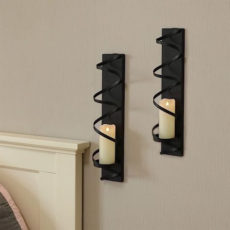 Unique Design: The Wall sconce candle holder has a delicate spiral design. The black matte finish adds an elegant and stylish vibe to the candle sconces and is the perfect complement to any home with modern, boho, or antique finishes Easy to Install: The metal candle sconces can be hung on the wall without assembly. Size: 16" H x 3.1" L, Candle tray diameter: 2.95", compatible with candles with a diameter of 2.95" or less (candles not included) Spiral Candle, Black Pillar Candles, Wall Candle Holder, Spiral Candles, Wall Candle, Decorative Wall Sconces, Led Pillar Candle, Wall Candle Holders, Candle Tray