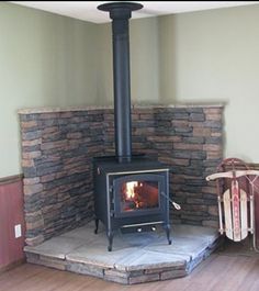 Hearth idea for pellet stove in kitchen sitting area. Wood Burning Stove Corner, Corner Wood Stove, Wood Stove Surround, Wood Stove Hearth, Wood Stove Wall, Wood Burning Stoves Living Room, Wood Heat, Wood Stove Fireplace, Into The Wood