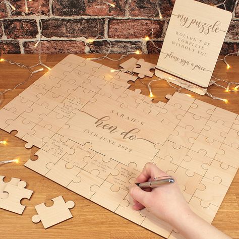 This stunning puzzle is a fun alternative to a traditional guest book to have your fellow hens to sign at your Hen Do! not given Supplied with either 26 or 58 pieces surrounding a large personalised centre piece of the puzzle which is engraved with your name and event date to create a wonderful keepsake. The puzzle is made from a beautiful 3mm Birch wood.Simply lay out the loose pieces and your guests can have fun writing on a piece and placing it around the puzzle, watching it build up the more Puzzle Guest Book Wedding, Puzzle Guest Book, Wedding Puzzle, Wedding Flip Flops, Puzzle Jigsaw, Birthday Star, Personalized Wedding Sign, Guest Book Alternative, Centre Piece