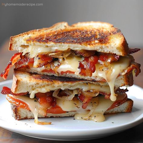 This Grilled Cheese, Bacon, and Oven-Dried Tomato Sandwich combines a variety of cheeses with crispy bacon and flavorful oven-dried tomatoes for a gourmet twist on the classic grilled cheese. Grilled Cheese With Bacon, Grilled Cheese Recipes Gourmet, Bacon Grilled Cheese Sandwich, Oven Dried Tomatoes, Chicken Breast Slow Cooker, Recipes Gourmet, Gravy Packet, Bacon Grilled Cheese, Gourmet Grilled Cheese