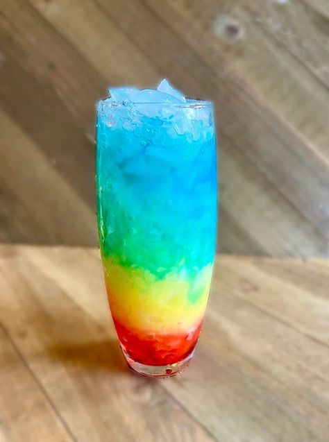 Rainbow Paradise Mocktail Recipe - FlyPeachPie Rainbow Mocktail Recipe, Rainbow Mocktails Non Alcoholic, Rainbow Stuff, Layered Drinks, Orange Julius, Blue Curacao, Mocktail Recipe, Pineapple Juice, Non Alcoholic