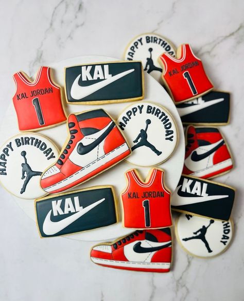 Let's make their first birthday a slam dunk! Order custom cookies that are perfect for your little one's theme!⁠ ⁠ ⁠ ⁠ ⁠ #dallascookies #dallasbaker #greatonecookies #decoratedcookies #dallascustomcookies #edibleart #cookieart #corporategifting #royalicingcookies #dfwcookies #dfwcustomcookies #dallaseventplanner #dallascookiecake #customcookiecake #shoecookies #nike #nikecookies #sportscookies #basketballcookies #firstbirthdaytheme #firstbirthdaycookies #marchmadness Nike 1st Birthday Party Ideas, 15 Birthday Boy Party Ideas, Nike Cookies Decorated, Nike First Birthday Theme, Basketball Birthday Cookies, Jordan 1 Birthday Theme, Treat Table Ideas Birthday, First Kickback Birthday Theme, Nike Theme Party Birthdays