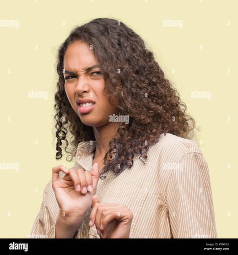 Download this stock image: Young hispanic business woman disgusted expression, displeased and fearful doing disgust face because aversion reaction. With hands raised. Annoying c - PW4E63 from Alamy's library of millions of high resolution stock photos, illustrations and vectors. Disgusted Face, Face Expressions, Business Women, Stock Photography, Aura, Stock Images, Resolution, Stock Photos, Illustrations