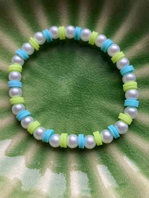 *Every purchase comes with freebies* Unique and fun 6.5 inch clay bead and white pearly beads bracelets ✨ tied with elastic for easy slip on and off ✨ multicoloured to add a splash of colour and different colours to match your style ⭐ rainbow, lime and blue, pastel pink and blue, mint and pink, purple/pink/green, black and white, orange and red styles. Pick a colour or have us surprise you with one! ✨ Can make different sizes and more of the same style, please message us for more. ✨ Thank you for supporting our small growing business ✨ Ask us any questions you may have! ✨Although we don't offer returns or exchanges at the moment, please do let us know if there are any issues with the order or delivery process. Make Clay Beads, Clay Bead Bracelets, Beaded Braclets, Preppy Bracelets, Clay Bead Bracelet, Bracelets Ideas, Growing Business, Clay Bracelet, Diy Bracelets Patterns