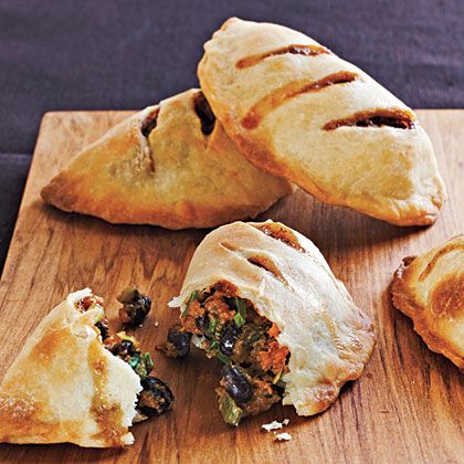 Sweet Potato and Black Bean Empanadas | Mild sweet potatoes and black beans take on smoky, spicy tastes from cumin and chiles. These pies are great served hot at a party; leftovers also make a tasty room-temperature snack. Bean Empanadas, Freezable Recipes, Black Bean Empanadas, Breakfast Empanadas, Sweet Potato And Black Bean, Macro Counting, Freezable Meals, Sweet Potato Black Beans, Empanadas Recipe