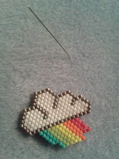 Brick stitch rainbow-cloud #motifmampapaye #mampapaye Cloud Bead Pattern, Miyuki Beads Pattern Brick Stitch, Beaded Cloud, Miyuki Brick Stitch, Stitch Rainbow, Brick Stitch Patterns, Bead Brooch, Miyuki Beads Pattern, Motifs Perler