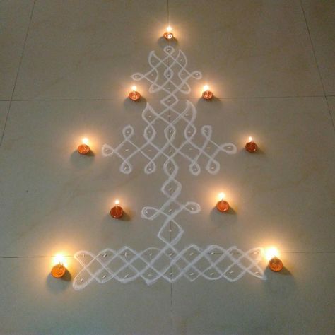 Vellaku Kolam A grand Vellaku Kolam, with 9-2 rows in the base, and 12 dots above forming a Deepam... With Diyas. Hope you all like it! Pl... Rangoli Side Designs, Alpona Design, Rangoli Designs Latest, Simple Rangoli Border Designs, Big Rangoli Designs, Easy Flower Drawings, New Rangoli Designs, Rangoli Kolam Designs, Simple Flower Design