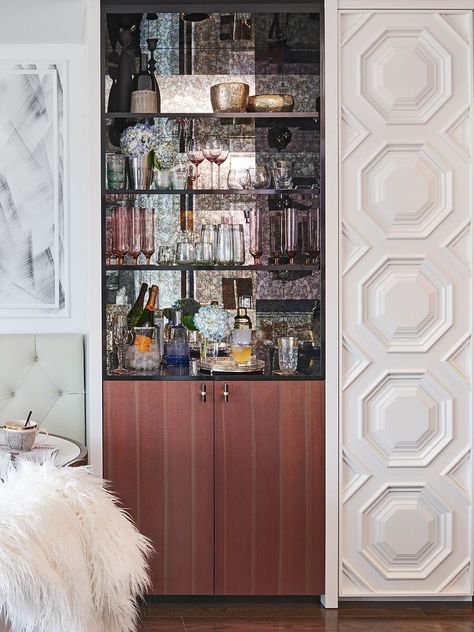 Feminine bar moment with smoked glass mirrors. Love how this is styled. Avenue | Stacey Cohen Design Mirror Drinks Cabinet, Mirrored Bar Wall With Shelves, Back Bar With Center Mirror, Modern Wet Bar Smoked Glass Mirror, Smoked Mirror Bar, Feminine Bar, Smoked Glass Wine Cabinet, Drinks Cabinets, Nero Marquina Bathroom