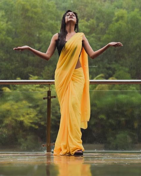 Image may contain: one or more people, people standing and outdoor Saree Poses Photoshoot Ideas, Rainy Photoshoot, Poses Photoshoot Ideas, Poses Photoshoot, Saree Poses, Self Portrait Poses, Indian Photoshoot, Saree Photoshoot, Couple Photoshoot Poses