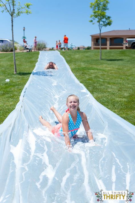 Don’t forget to cover your body with soap to go extra fast!Full instructions on All Things Thrifty. Diy Slip And Slide, Homemade Water Slide, Giant Slip And Slide, Water Slides Backyard, Homemade Slip And Slide, Slip N Slide, Fiesta Tropical, Goodbye Summer, Ideas Backyard