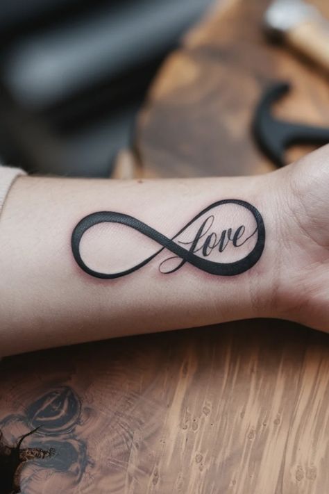 Infinity symbol tattoo with the word "Love" on a wrist. Infinity Wrist Tattoo, Tattoo Ideas For Females, Unique Infinity Tattoo, Infinity Tattoo On Wrist, Meaningful Tattoo Ideas, Infinity Symbol Tattoo, Unique Tattoo Ideas, Symbol Tattoo, Meaningful Tattoo