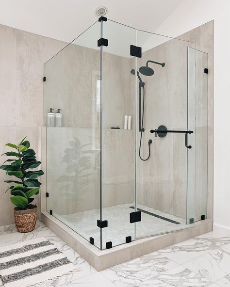 Happy Monday 🙂‍↔️🚿 This week, we are diving into our favorite shower projects and we want to hear from YOU! Which one is your absolute favorite? Is it the luxurious rain shower head or the sleek and modern glass enclosure? Share your thoughts in the comments below! 💭 Let’s start this week off with some inspiration and creativity for our next bathroom project. #ShowerProject #BathroomDesign #HomeImprovement #LuxuryLiving #ShowerEnvy #ProfessionalTone #ShowerDesign #Bathroom #BathroomRemodel ... Glass Shower Bathroom, Modern Bathroom Makeover, Kitchen And Bathroom Remodeling, Modern Bathroom Remodel, Shower Glass, Beige Bathroom, Kitchen Bathroom Remodel, Cabinets And Countertops, Bathroom Plants