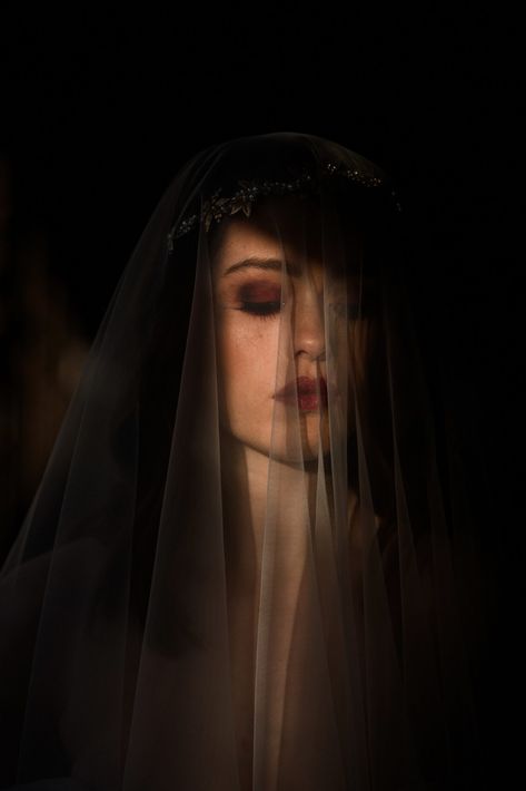 Bride pictured wearing a veil lit by golden sunlight on her face. Dark, winter wedding makeup inspiration. Civic House Glasgow Wedding Dress Editorial » Zoe Alexandra #winterweddinginspiration #winterwedding #bride #artisticbridalportraits Dark Wedding Photoshoot Ideas, Dark Wedding Pictures, Dark Romantic Photography, Dark Wedding Photoshoot, Moody Wedding Inspiration, Moody Bridal Portraits, Goth Wedding Photos, Gothic Wedding Photography, Dark Wedding Photos