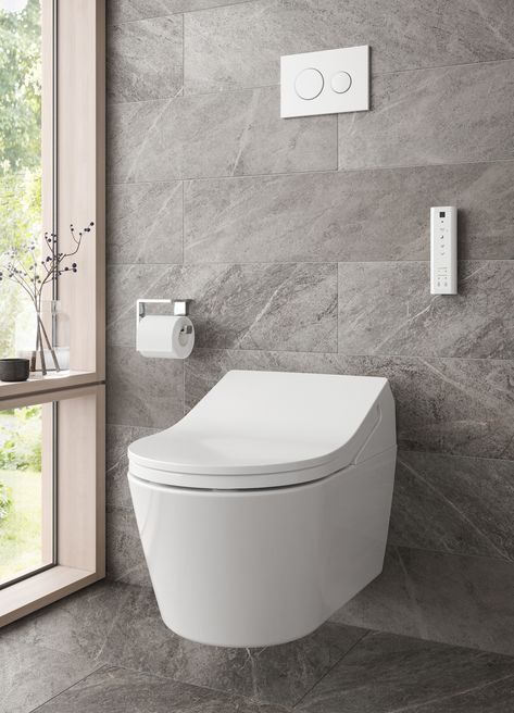 Continuous dark gray tile from wall to floor provides a seamless backdrop for a sleek, modern wall-hung toilet. Japan Bathroom, Toto Bidet, Toto Bathroom, Toto Washlet, Japanese Toilet, Rv Bathroom, Toilet Installation, Counter Decor, Bathroom Counter